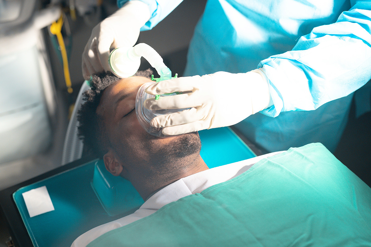 Dr. Chavez and a patient discuss treatment during a dental implant consultation.